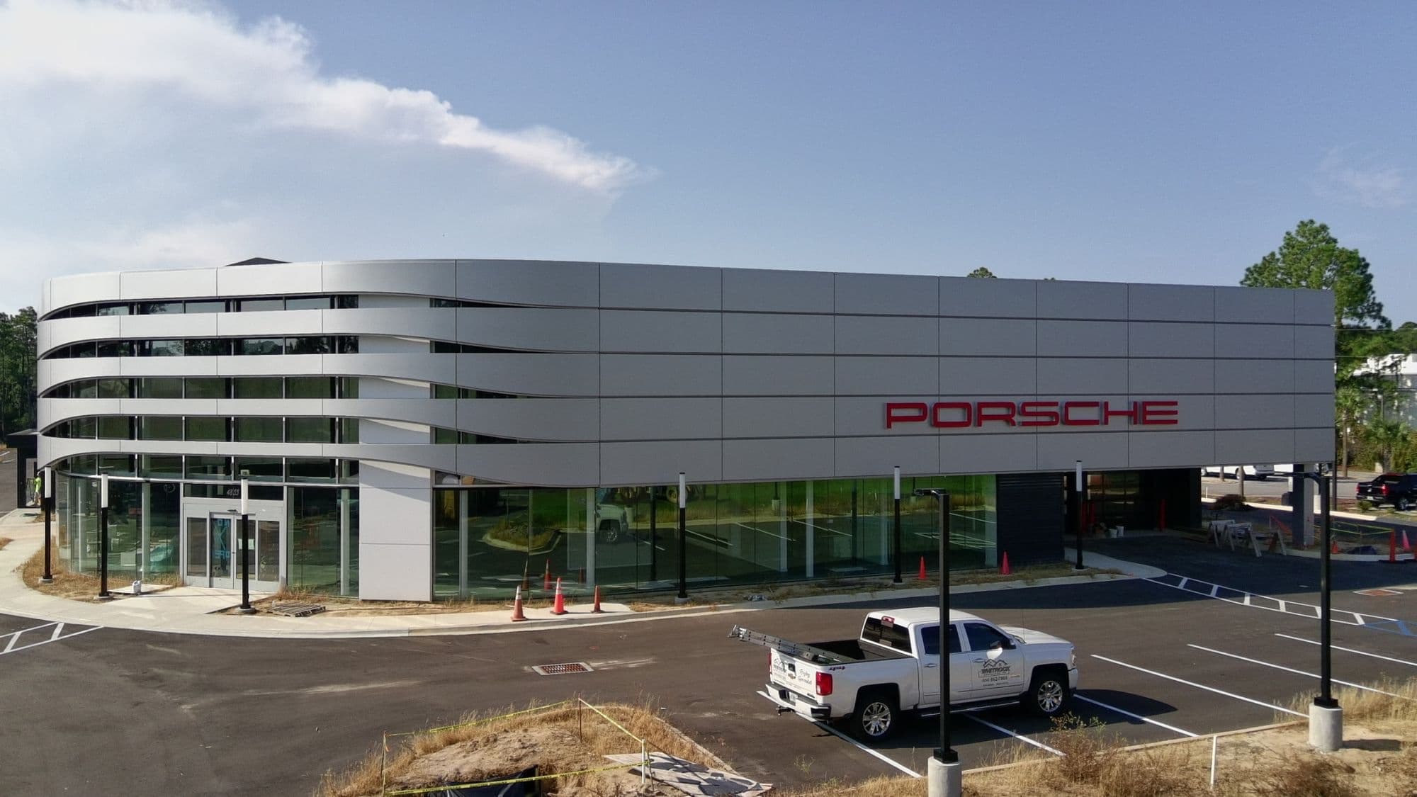 Front elevation of a Porsche dealership showroom constructed by Whitrock Associates in Northwest Florida