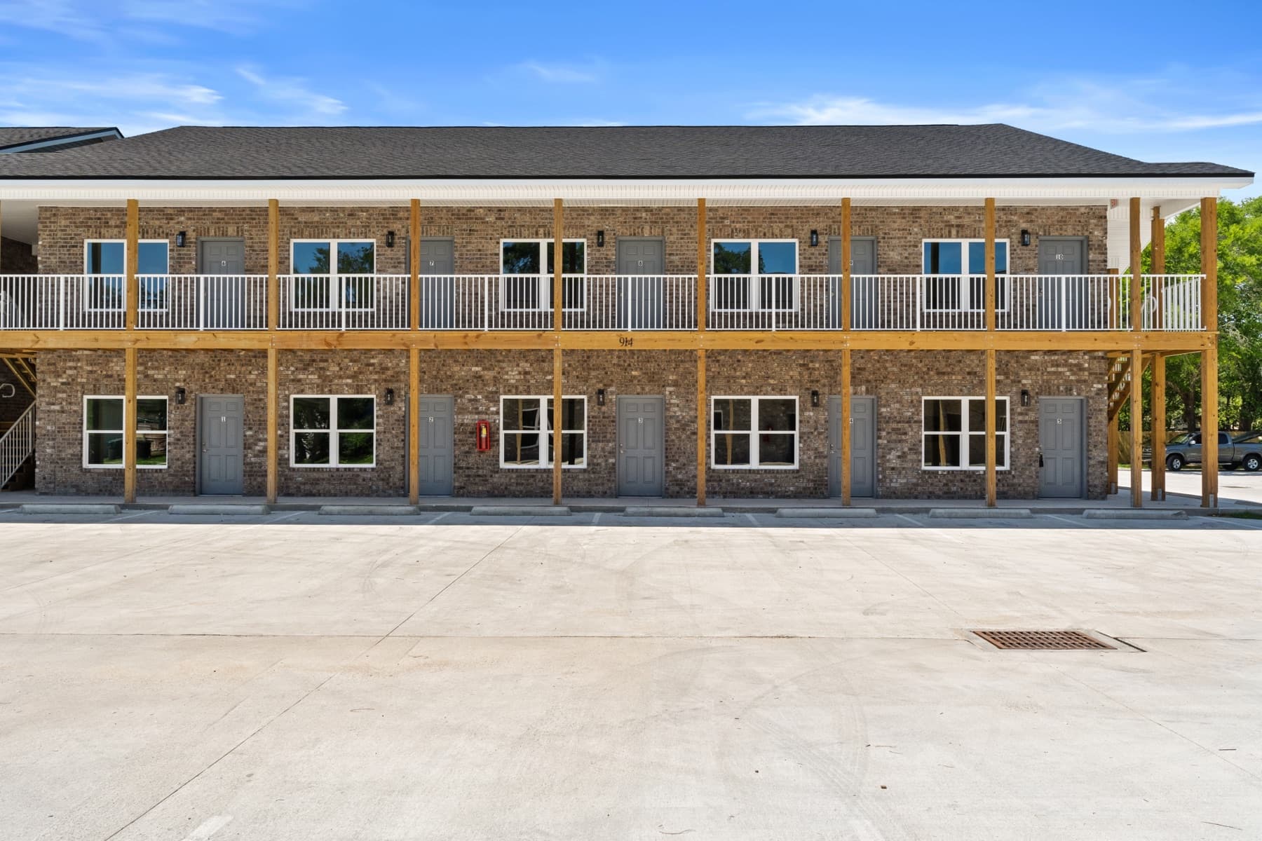 Front elevation of a new two-story brick ten-unit apartment building constructed from the ground up by Whitrock Associates in Northwest Florida