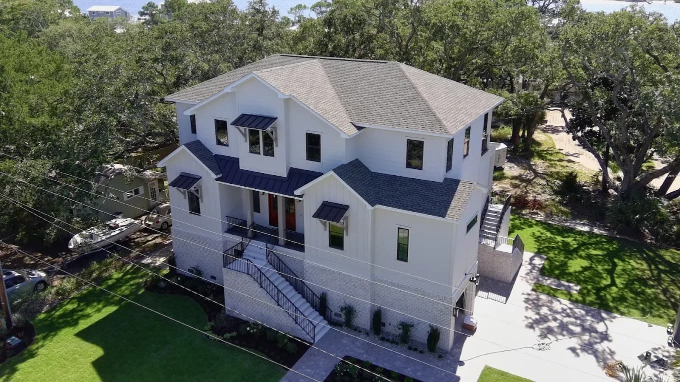 Coastal Destin, FL two-story home with a new architectural shingle roof by Whitrock Associates