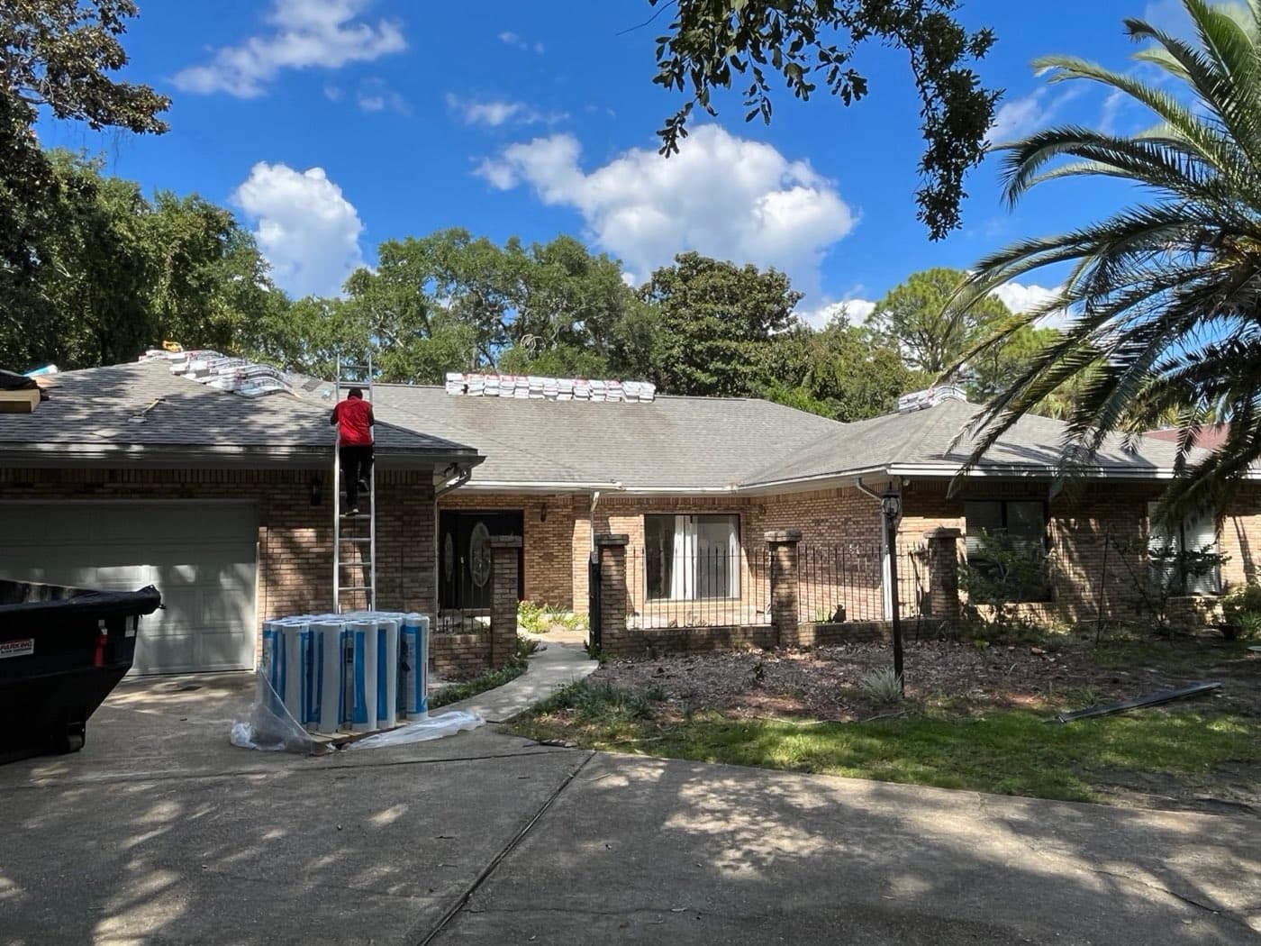 Whitrock Associates roofer inspecting a residential roof in Northwest Florida