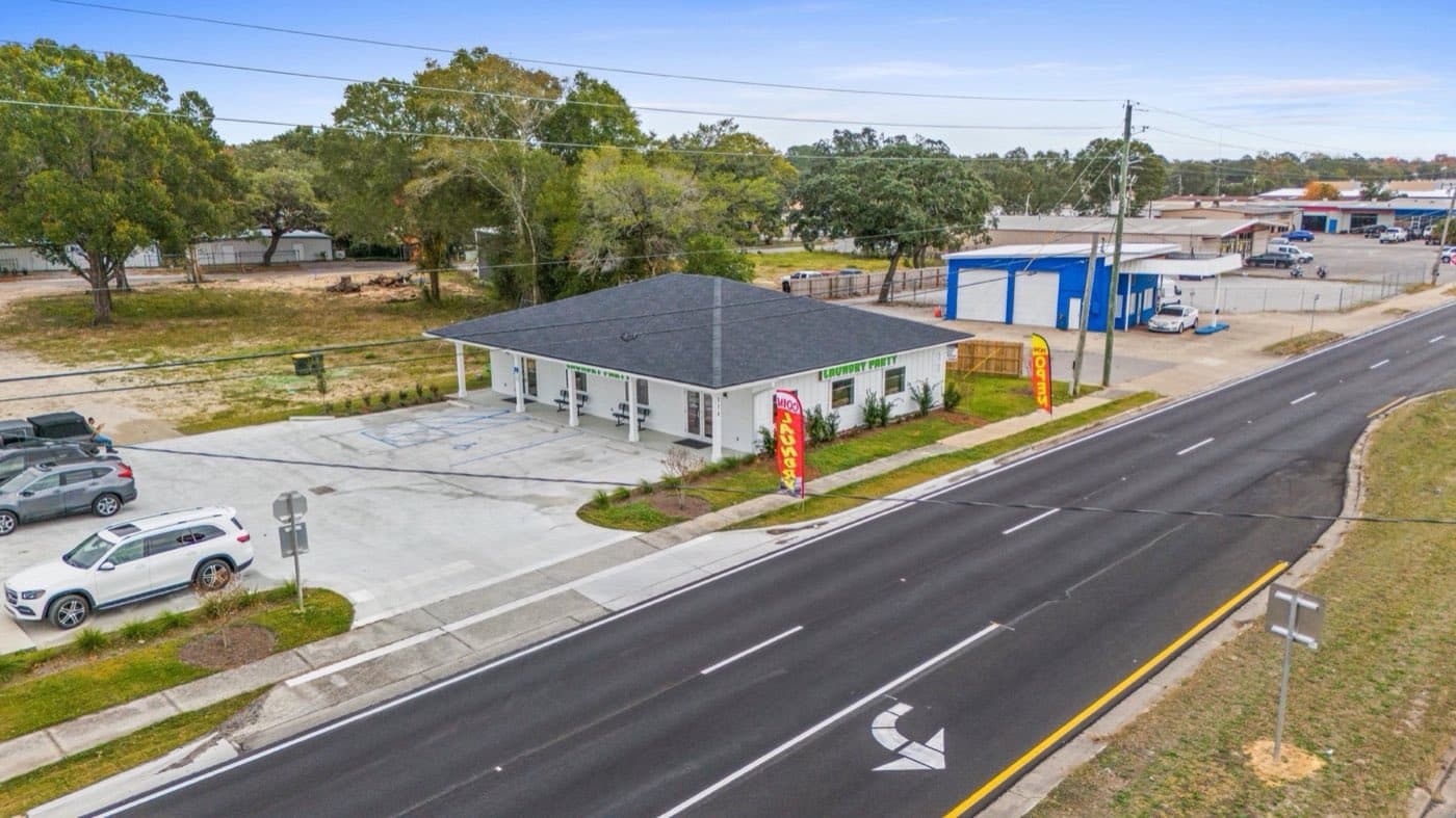 Street view of a completed commercial reroof in Fort Walton Beach, FL by Whitrock Associates