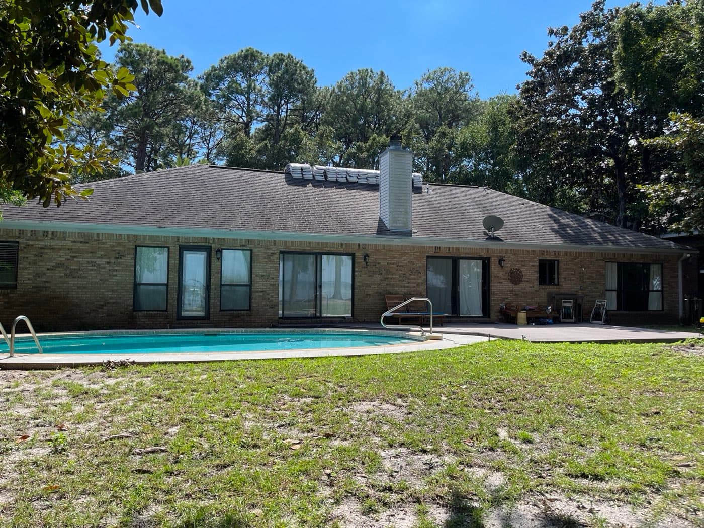 New architectural shingle roof on a Mary Esther, FL pool home by Whitrock Associates