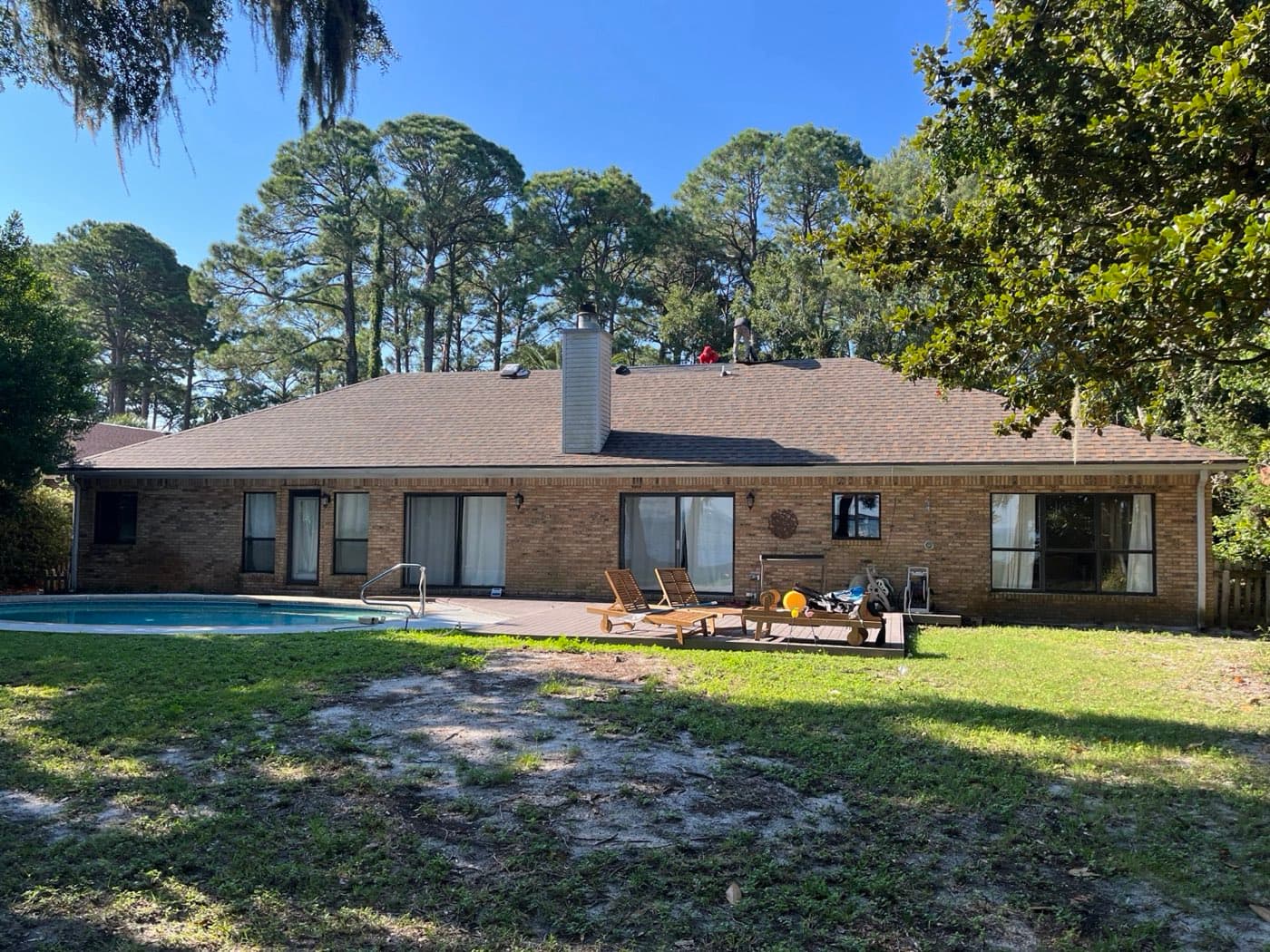 New architectural shingle roof on a Destin, FL pool home by Whitrock Associates
