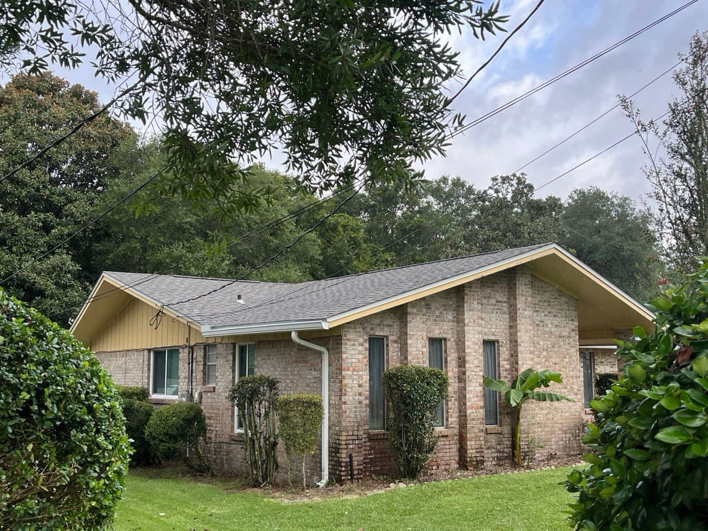 Finished shingle roof replacement on a Milton, FL brick ranch by Whitrock Associates