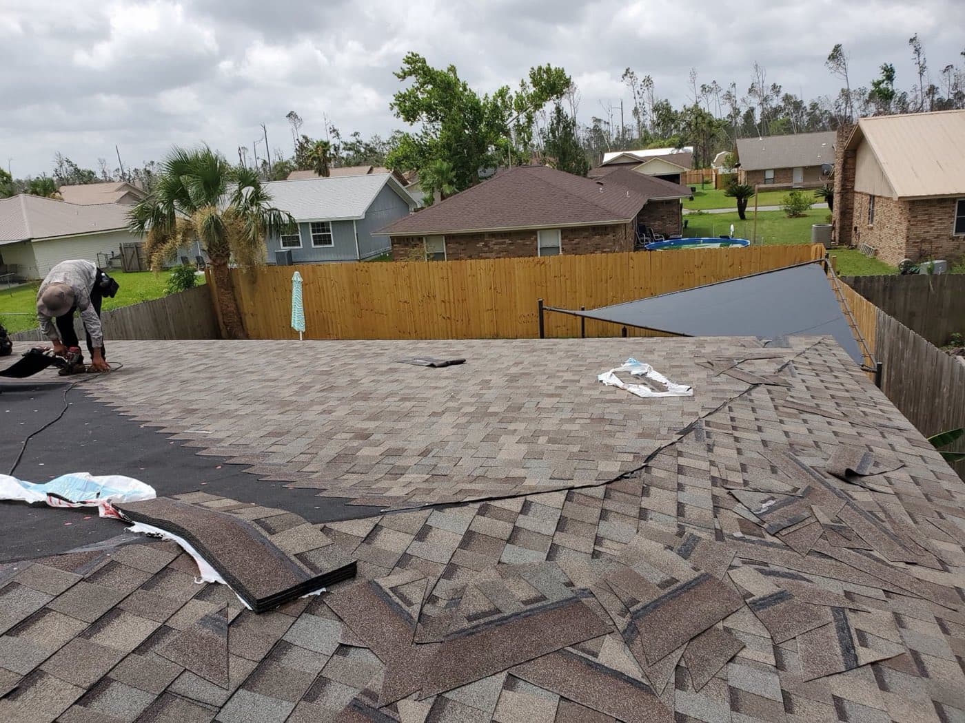 Storm-damaged roof tear-off by Whitrock Associates, Northwest Florida