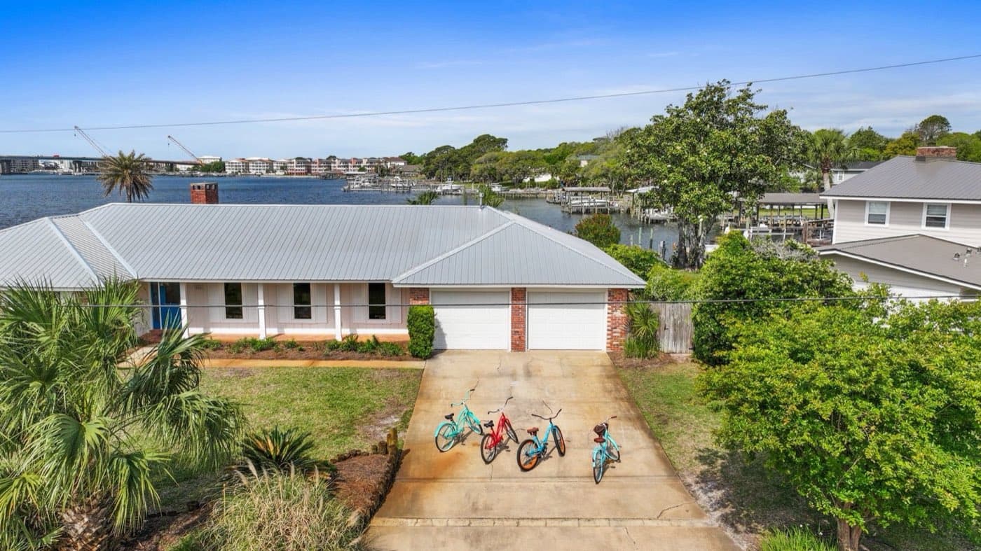 Aerial view of a waterfront Pensacola Beach, FL home with a new metal roof by Whitrock Associates